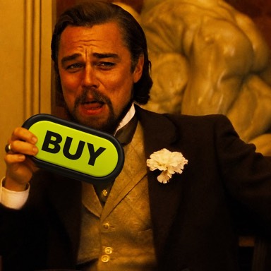 A film character raises a drink while holding a large Buy Button.